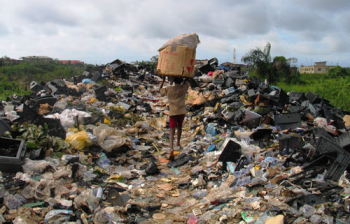 A boy hauls e-waste in Lagos, Nigeria