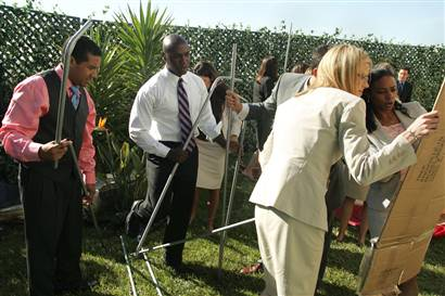 The Apprentice cast putting up a tent