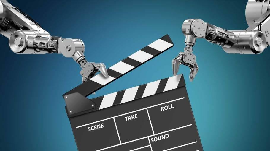 Two mechanical robot hands holding a film slate