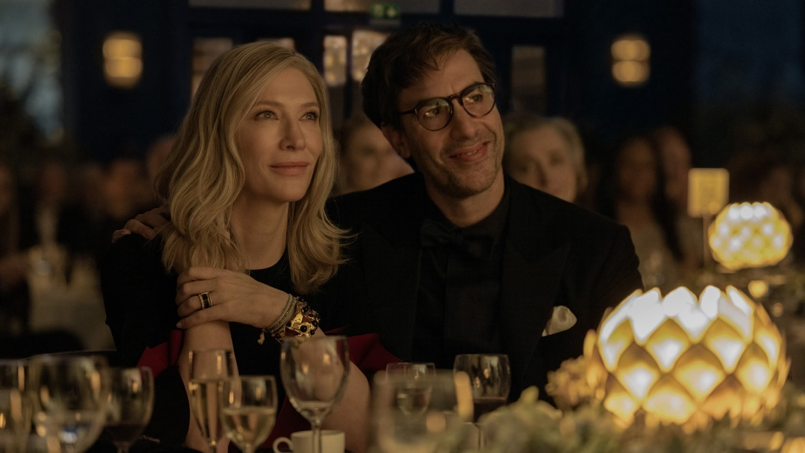 screenshot of two characters from TV series Disclaimer sitting with each other with various glasses in front of them